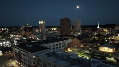 Jackson,-Michigan-downtown-at-night-with-drone-video-wide-shot-at-an-angle-moving-in