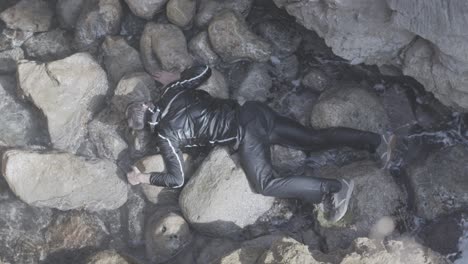 man caught in a coastal torrent