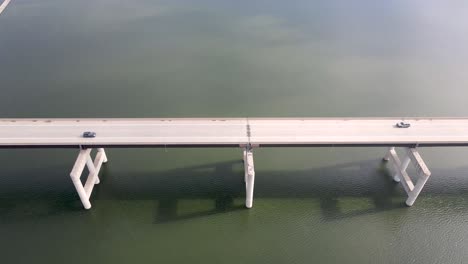 cars traveling on road trip over bridge of the ozarks, missouri