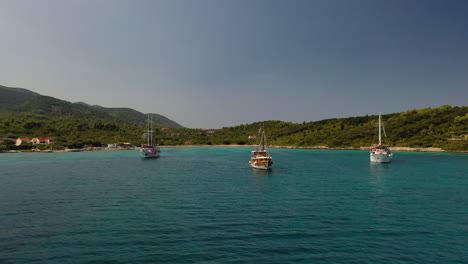 Beautiful-luxury-yachts-moored-in-Adriatic-Sea-Croatia,-aerial-pull-away-reveal