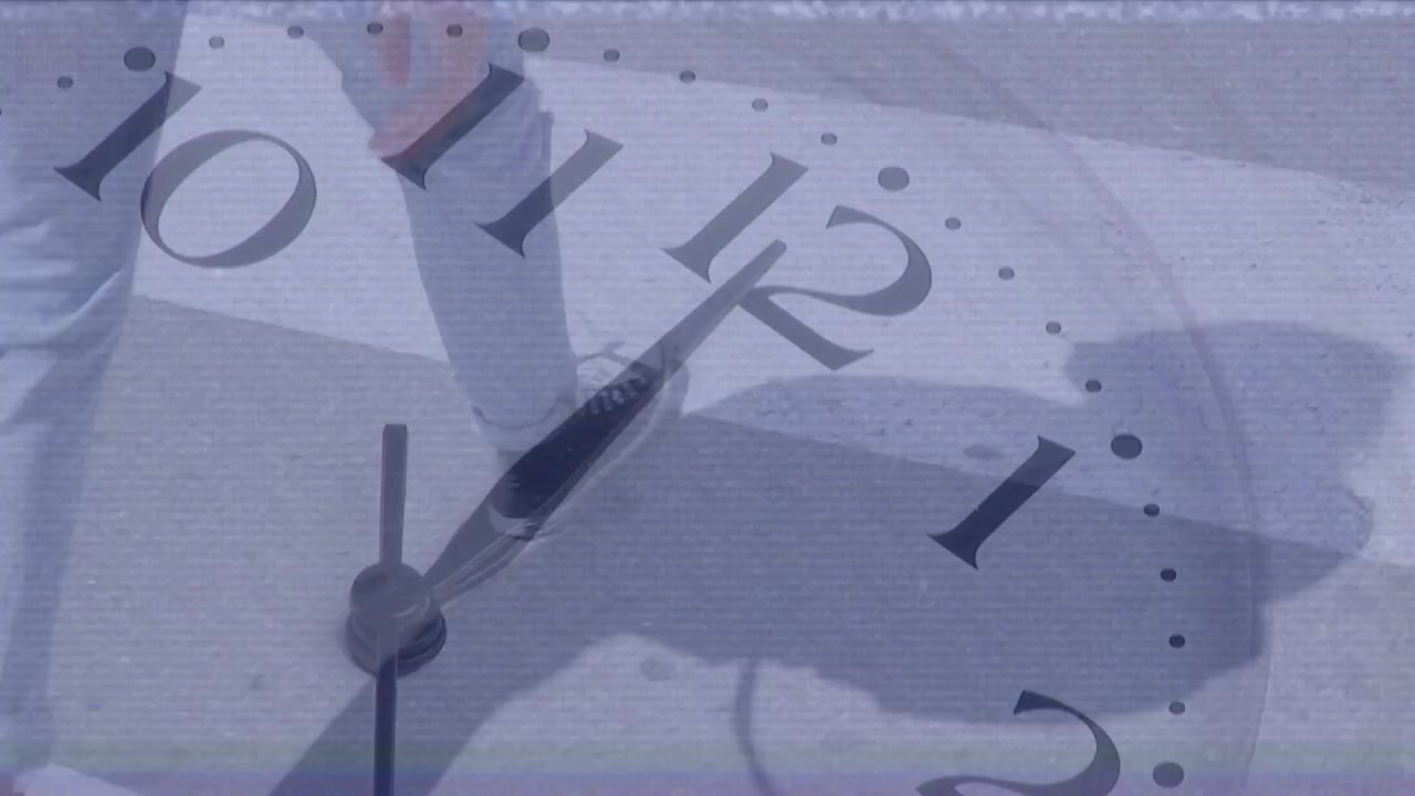 Animation of clock moving over caucasian man walking