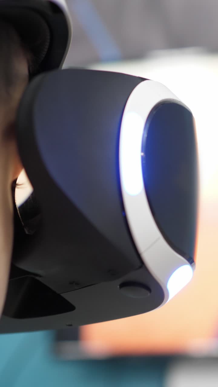 Close-up of a person wearing a virtual reality headset, showcasing advanced technology and immersive experience in a modern gaming environment