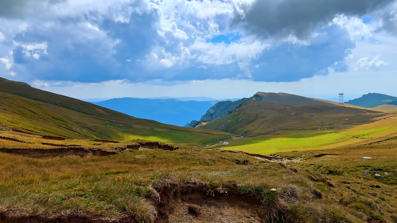 Rugged rocky cliffs of the Bucegi Mountains. The geological formations rise sharply against the sky