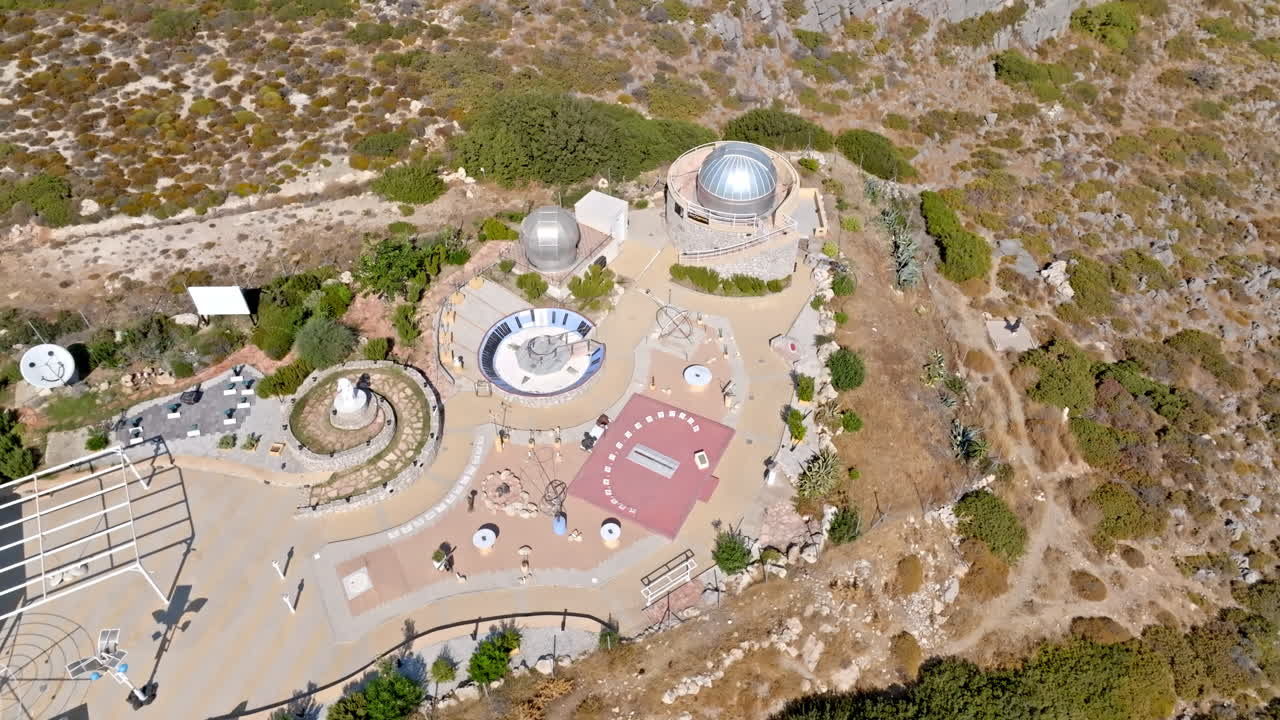 Aerial view orbiting the Faliraki observatory, sunny day in Rhodes, Greece
