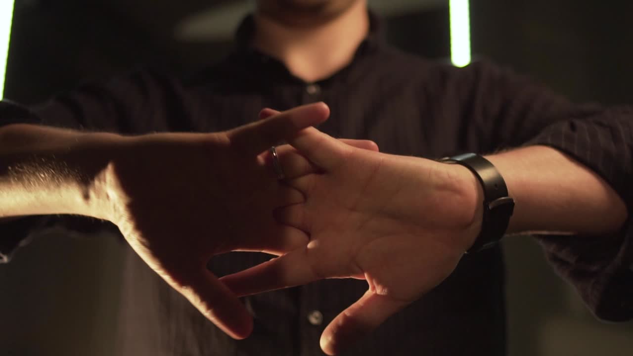 Man Performing Magic Trick with Hands