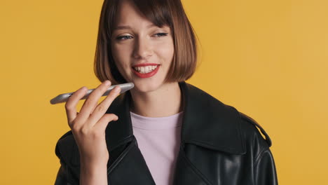 brunette woman sending voice mail