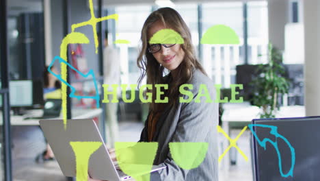 smiling at laptop, businesswoman viewing animation of huge sale in office