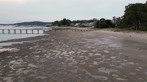 low tide and a boat jetty at salamander bay's soldiers point nsw australia