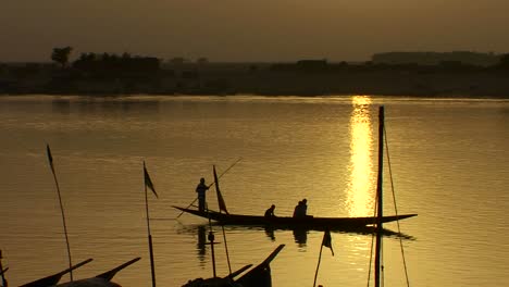 boats are rowed on the niger river in beautiful golden light in mali africa 1