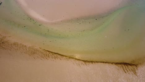 tropical sand cays with turquoise river running through