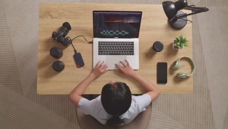 woman celebrating successful video editing project