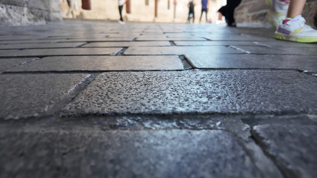 Cobblestone street with pedestrians