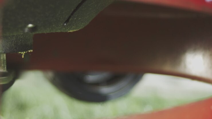 Close-up view of a lawn mower undercarriage