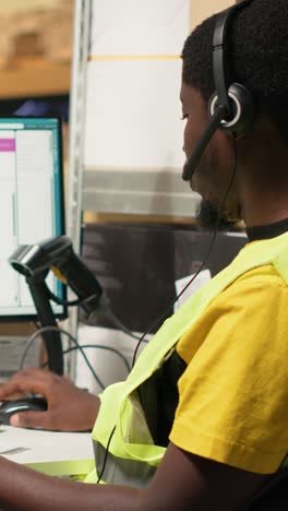 vertical video black call center operator assisting a client with order mix up problems
