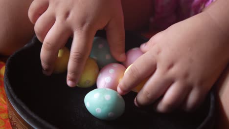 child playing with easter eggs