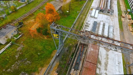 Dron-view-industrial-crane-on-background-factory.-Industrial-crane-at-plant