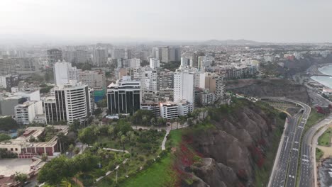 Aerial-drone-morning-footage-of-Lima-skyline,-the-capital-city-of-Peru-in-South-America-Miraflores-Chorrillos-Barranco-Malecón-de-Miraflores-cliffs