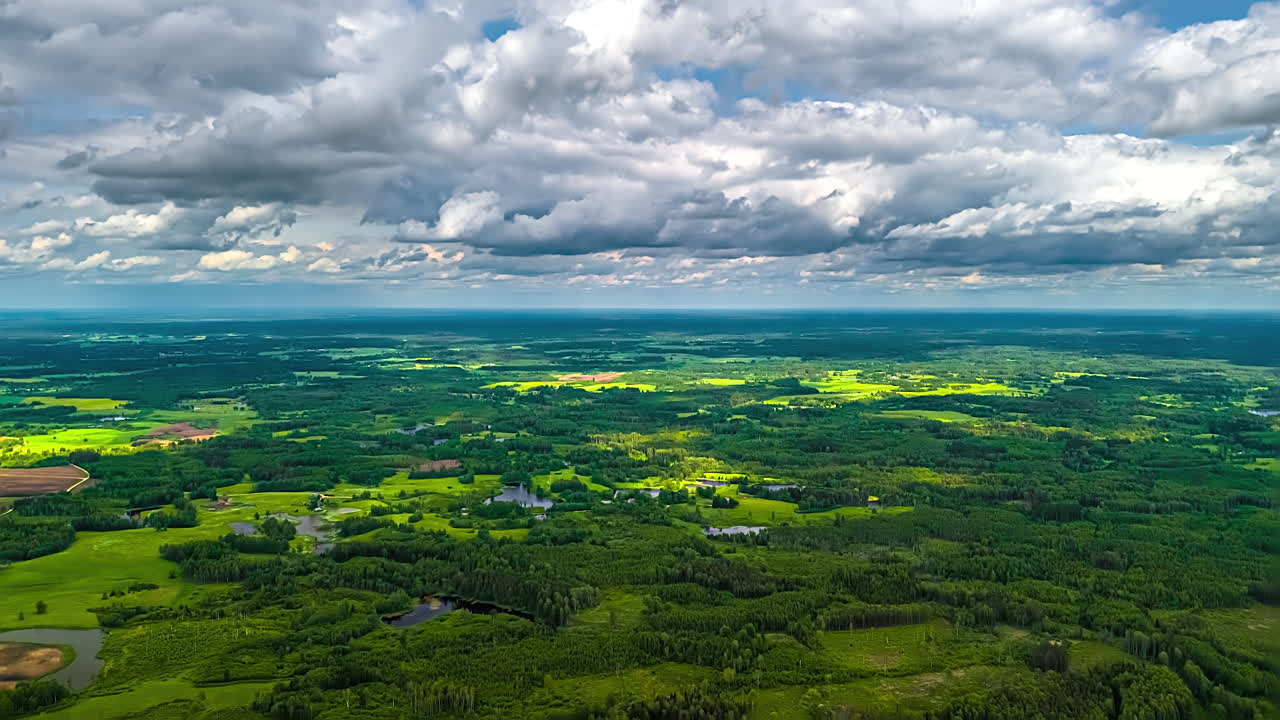 Soft shadows pass over farmland in a calm countryside scene with smooth daylight motion, aerial dolly left hyperlapse