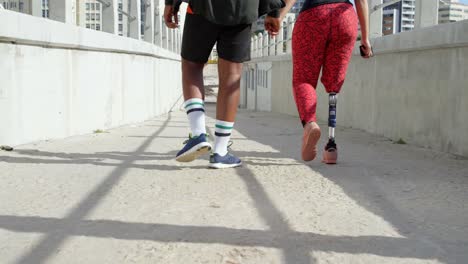 rear view of couple walking with hand in hand on promenade 4k