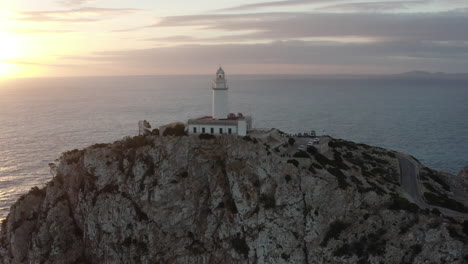 Sunrise-Drone-Shot-over-the-Lighthouse-of-Cap-Formentor,-Mallorca