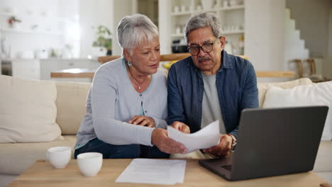 Old-people,-laptop-and-paperwork