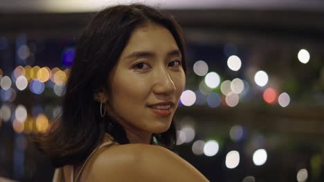 happy woman at night in city