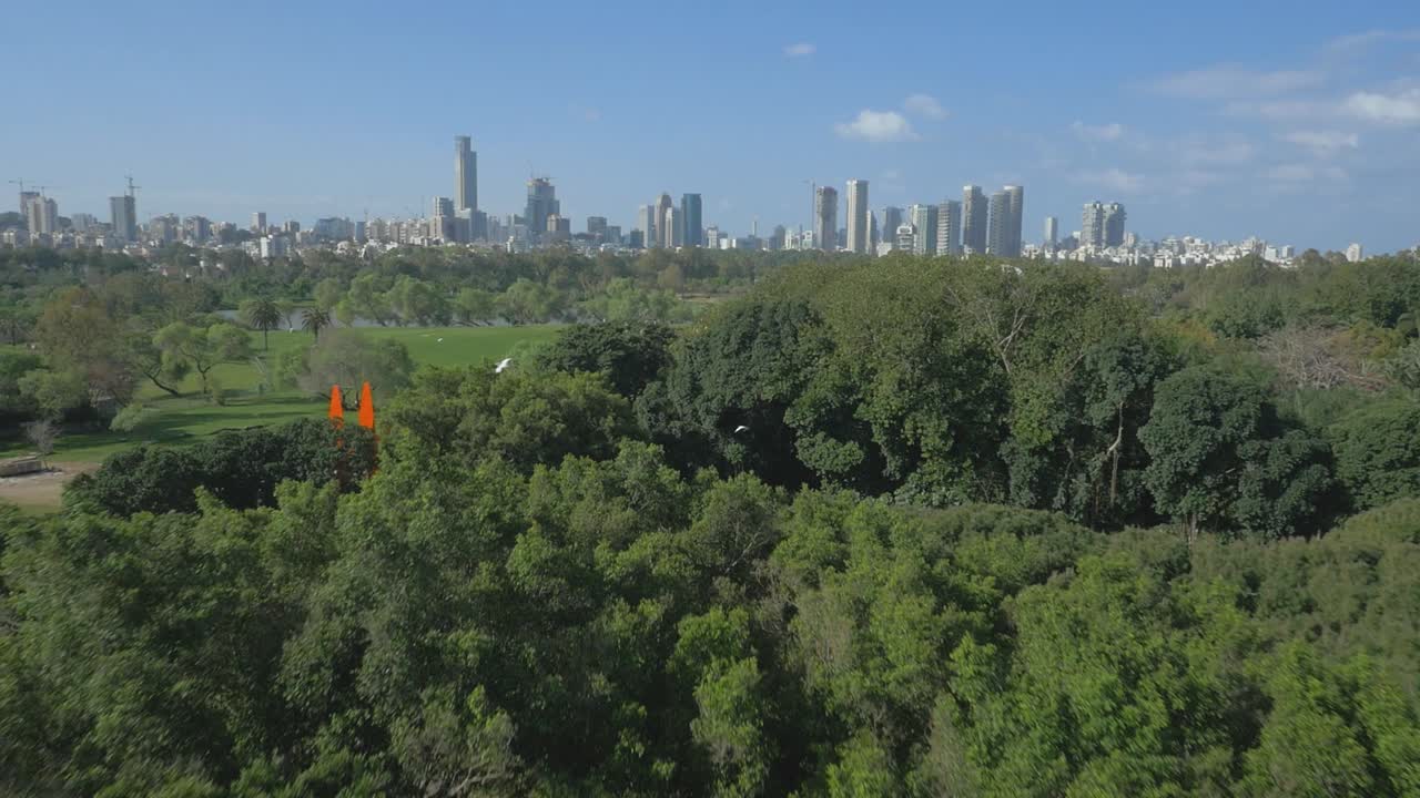 North Tel Aviv park Yarkon aerial skyline. Above the park with Tel Aviv's skyscrapers on the horizon