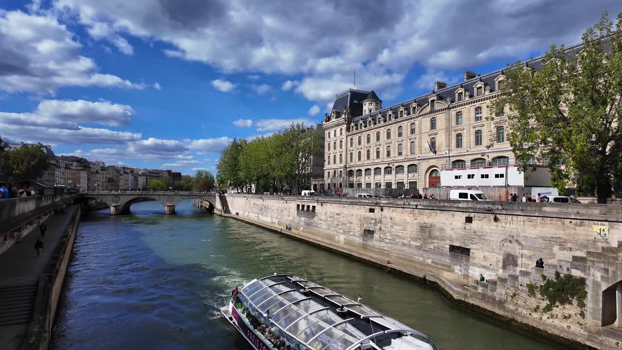 Seine river boat Paris capital of France with people walking summer day
