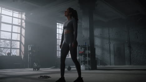 woman walking in gym after training. sportswoman relaxing between exercises