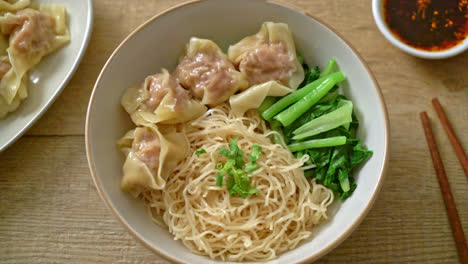 dried egg noodles with pork wonton or pork dumplings without soup asian food style