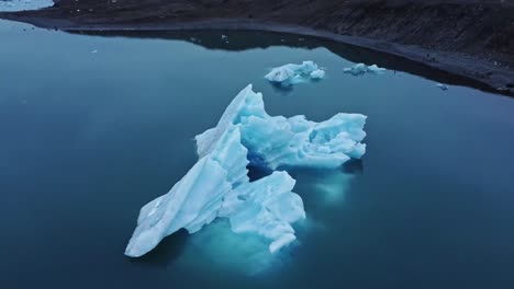 snowy icebergs in sea water