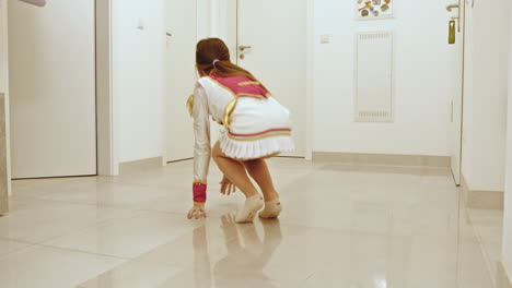 Child Dancing in a Hallway
