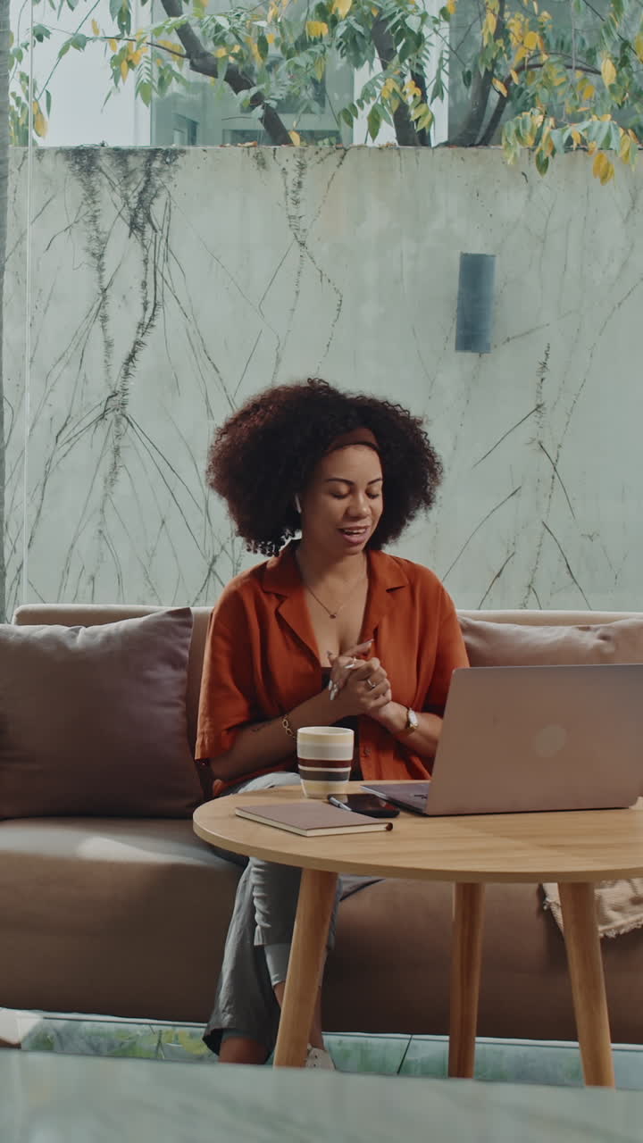 Freelance Employee Talking on Video on Laptop at Home