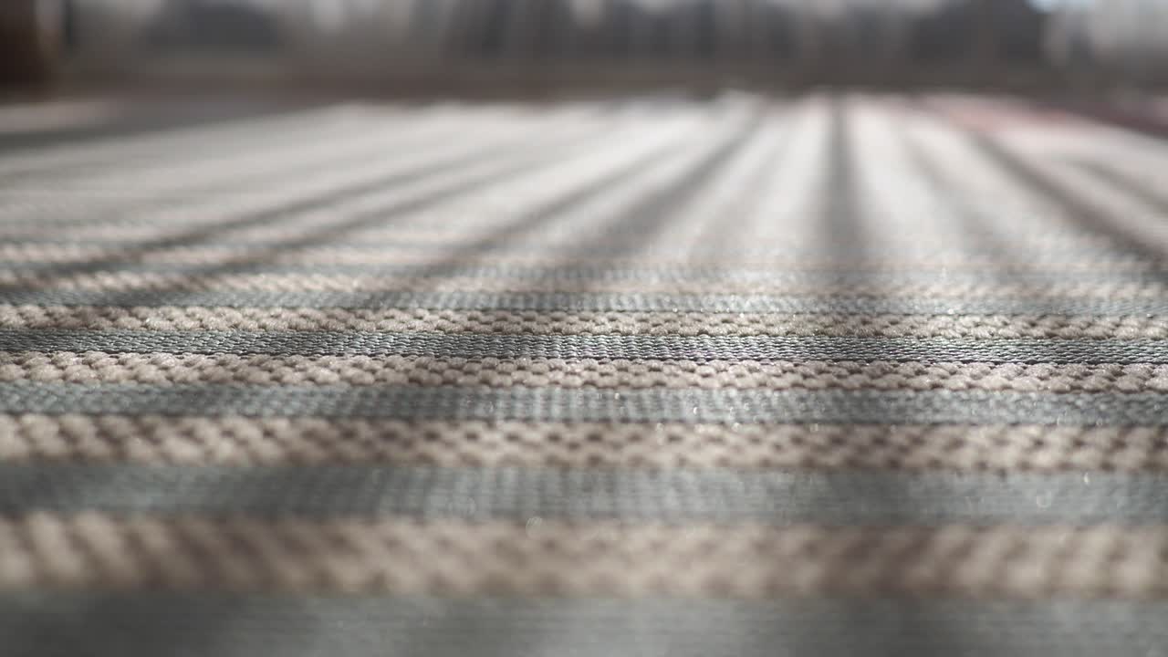 Close-up of a striped carpet texture