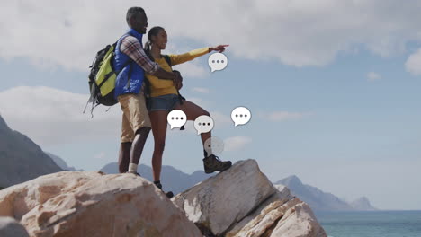 hiking couple exploring rocky coast, showing health industry data chart and heart icon