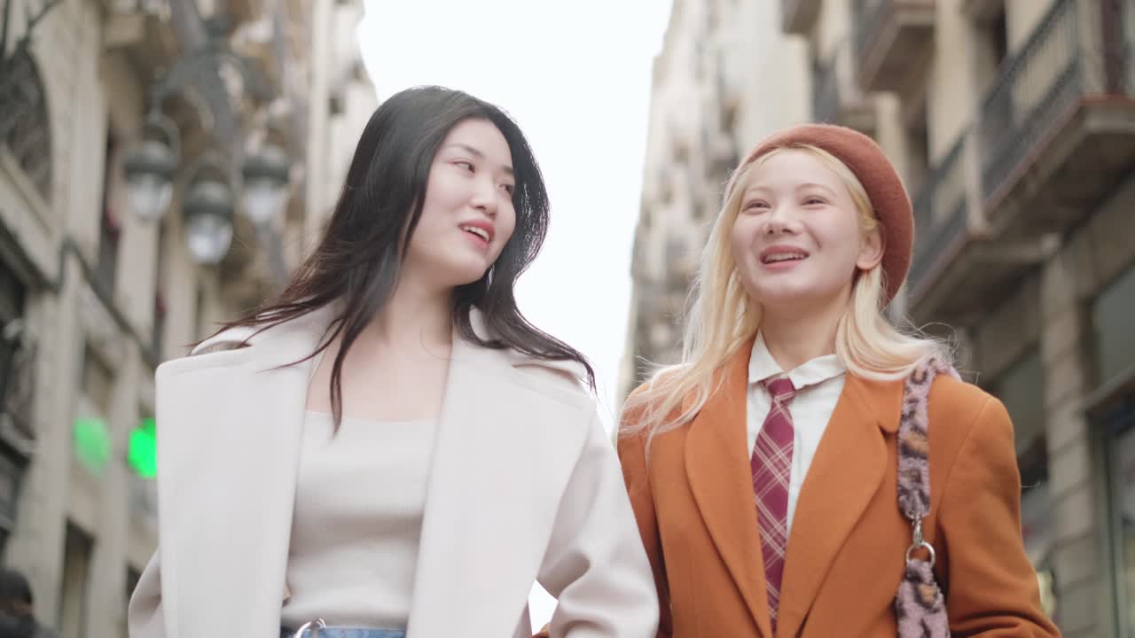Two stylish women in a city street