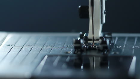 manufacturing equipment at textile factory. sewing needle in slow motion