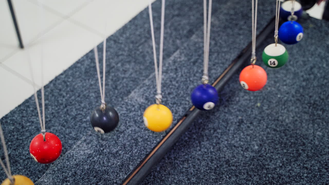 Balancing balls of Newton's cradle. Museum of Science