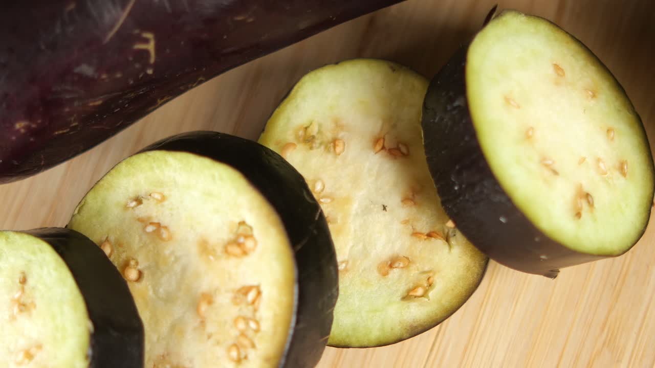 Sliced Eggplant on Wooden Cutting Board