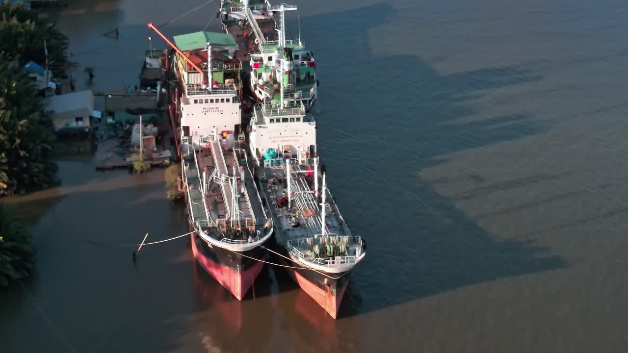 Ships docked at a port in Bangkok offering a view of the Thai landscape