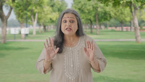 Angry-Indian-old-woman-shouting-at-someone-in-park