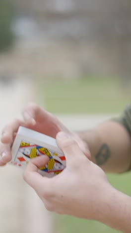 hands shuffling playing cards