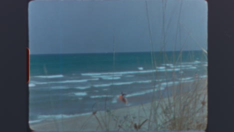 vintage film footage of beach and ocean with dunes