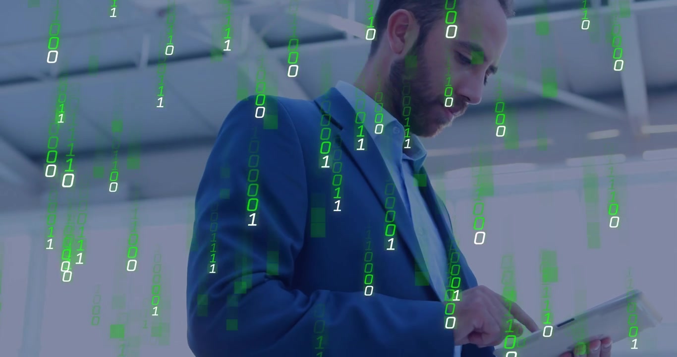 Tech executive tapping tablet, activating green binary overlay while viewing data, camera widening