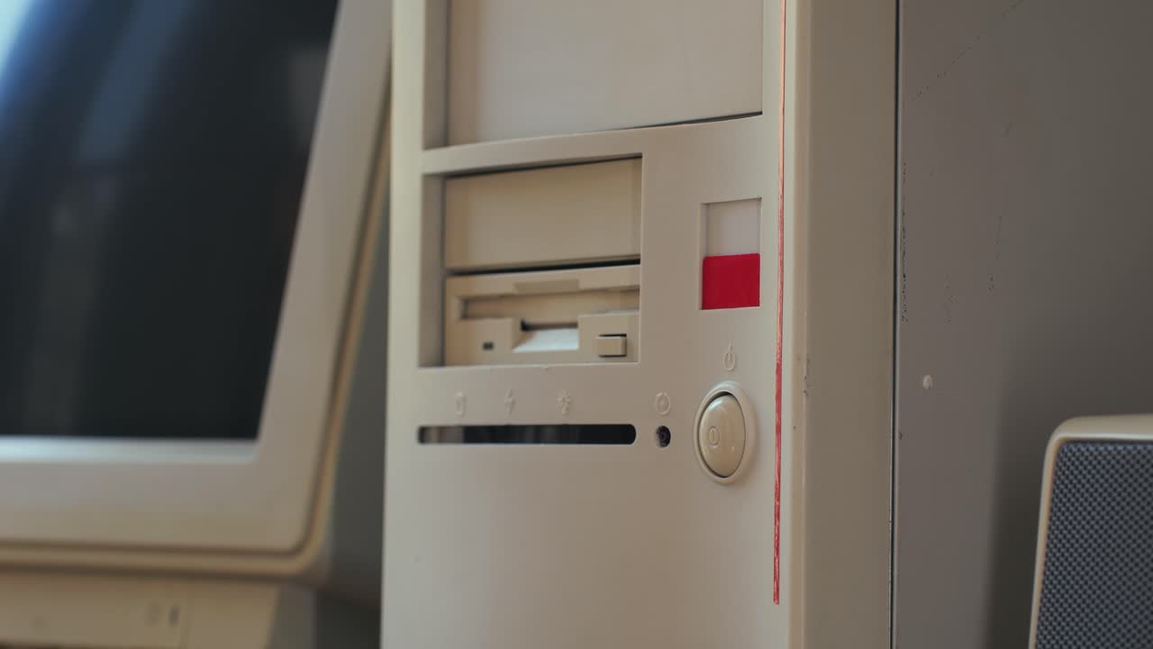 Man working and gaming on retro computer PC, IT engineer with vintage computer at home, using old fashion technology, close up of retro setup.