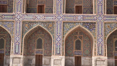 rows of archways at islamic school madrassa in samarkand, uzbekistan along the historic silk road