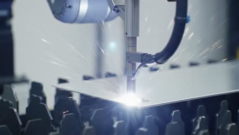 precision laser welding process: a high-performance robotic arm engaging in metal fabrication with spectacular sparks and seamless joints in an industrial setting