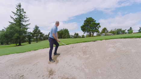 male golf player playing golf and knocking golf ball out on golf course