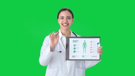 Happy-Indian-female-doctor-explaining-condition-to-patient-Green-screen