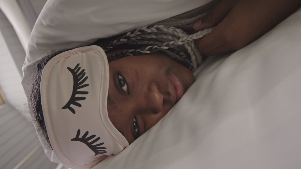 Young Black Woman with Lashes Sleep Mask